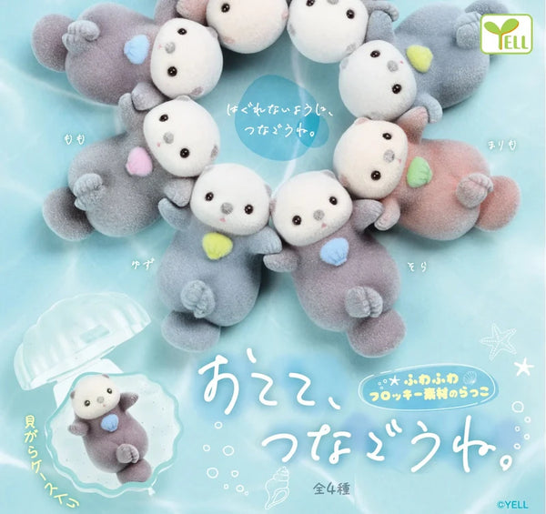 Flocked Sea Otters Holding Hands in a Shell Capsule Toy